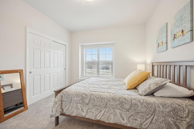 carpeted bedroom with a closet
