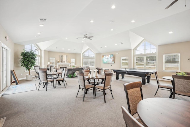 game room with ceiling fan, light carpet, and lofted ceiling