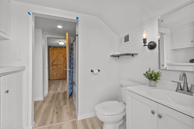 full bathroom with vanity, visible vents, toilet, and wood finished floors