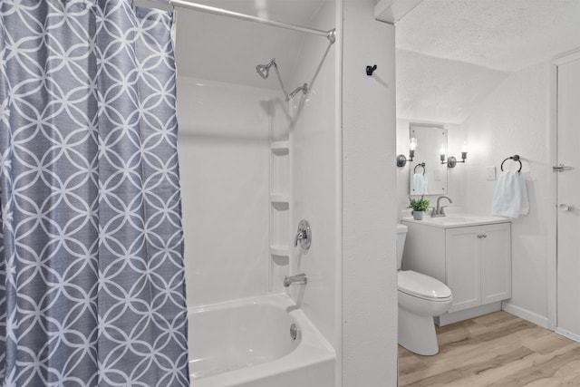 full bath featuring shower / tub combo, vanity, toilet, lofted ceiling, and wood finished floors