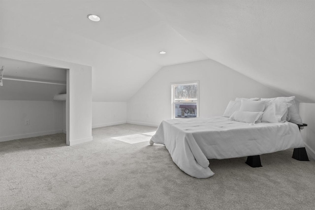 carpeted bedroom featuring recessed lighting, baseboards, and lofted ceiling