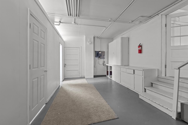 interior space with stairway and electric panel