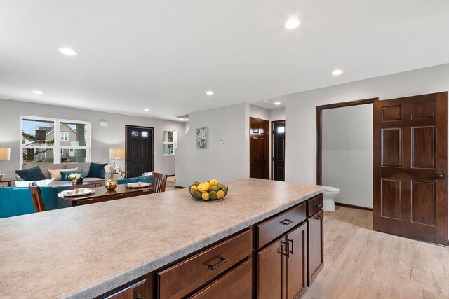 1143 Fillmore Ave, Oshkosh, WI 54902 - kitchen featuring recessed lighting, light countertops, light wood-style flooring, and open floor plan