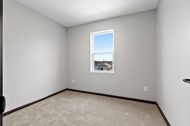 1143 Fillmore Ave, Oshkosh, WI 54902 - carpeted empty room featuring baseboards