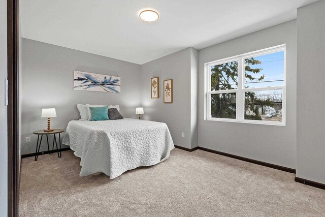1143 Fillmore Ave, Oshkosh, WI 54902 - carpeted bedroom featuring baseboards