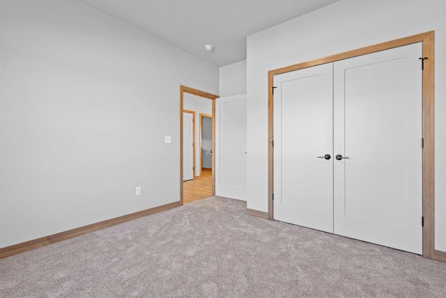 3106 Lazy Oak Dr, Green Bay, WI 54311 - unfurnished bedroom with a closet, baseboards, and carpet floors