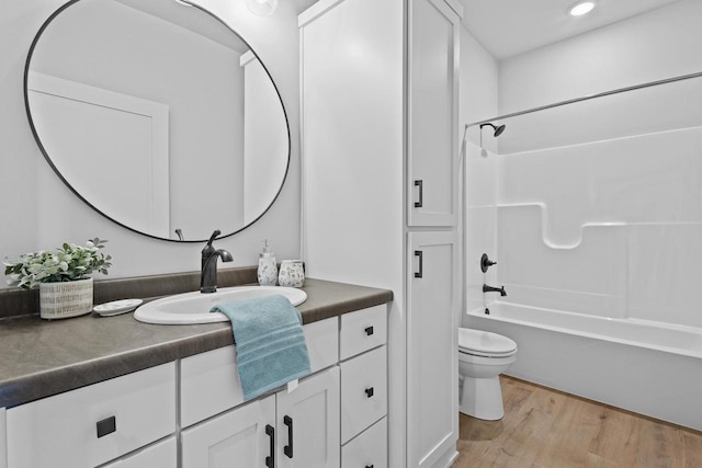 3106 Lazy Oak Dr, Green Bay, WI 54311 - bathroom featuring toilet, recessed lighting, vanity, wood finished floors, and shower / tub combination