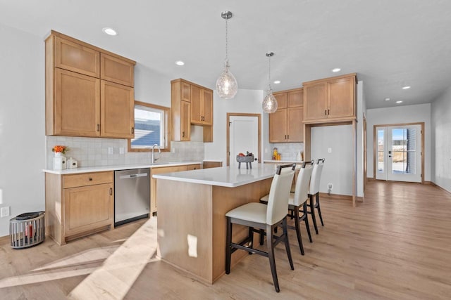 3106 Lazy Oak Dr, Green Bay, WI 54311 - kitchen with plenty of natural light, light wood finished floors, and dishwasher