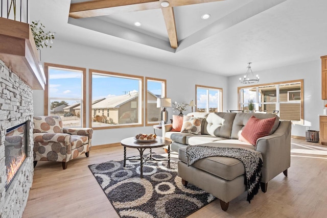 3106 Lazy Oak Dr, Green Bay, WI 54311 - living room with baseboards, an inviting chandelier, a fireplace, recessed lighting, and light wood-style flooring
