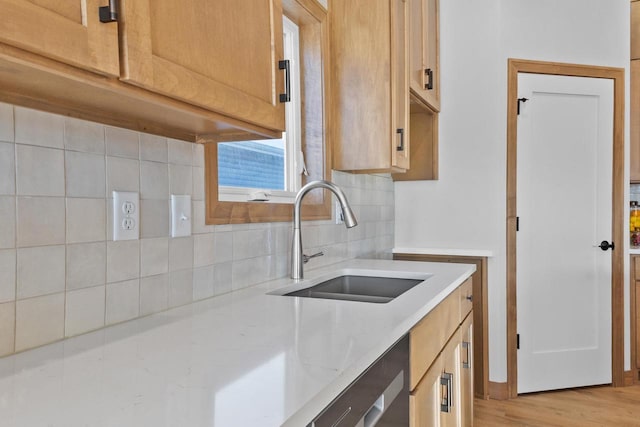 3106 Lazy Oak Dr, Green Bay, WI 54311 - kitchen featuring light stone countertops, light wood-style floors, decorative backsplash, dishwasher, and a sink