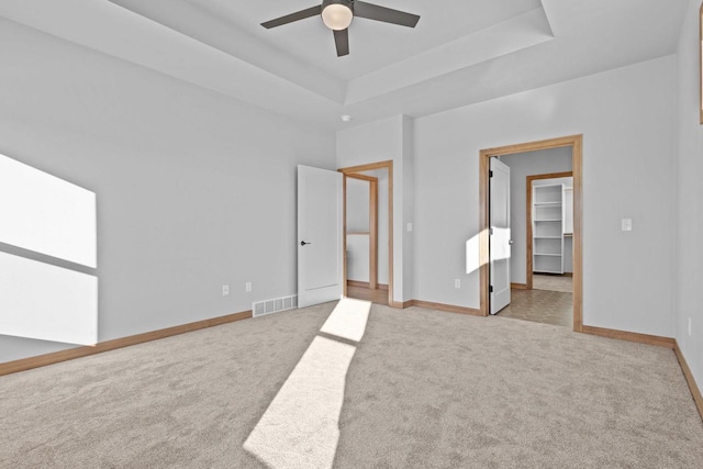 3106 Lazy Oak Dr, Green Bay, WI 54311 - unfurnished bedroom featuring carpet flooring, visible vents, baseboards, and a raised ceiling