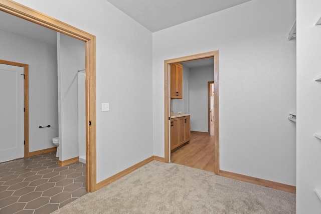 3106 Lazy Oak Dr, Green Bay, WI 54311 - unfurnished bedroom with carpet flooring, ensuite bathroom, and baseboards