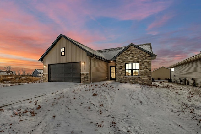 3106 Lazy Oak Dr, Green Bay, WI 54311 - view of front of house with concrete driveway, stone siding, and an attached garage