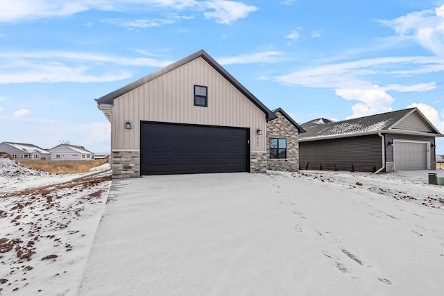 3106 Lazy Oak Dr, Green Bay, WI 54311 - view of front of house with a garage and stone siding