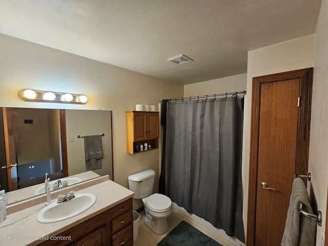 bathroom with visible vents, a shower with curtain, toilet, vanity, and tile patterned floors