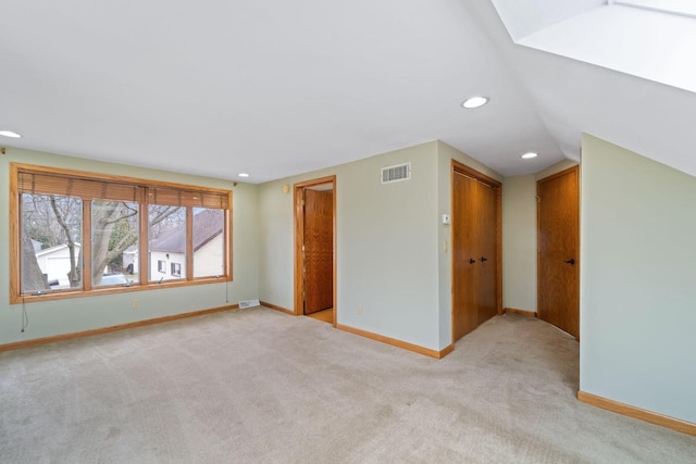 interior space with light colored carpet, baseboards, visible vents, and recessed lighting