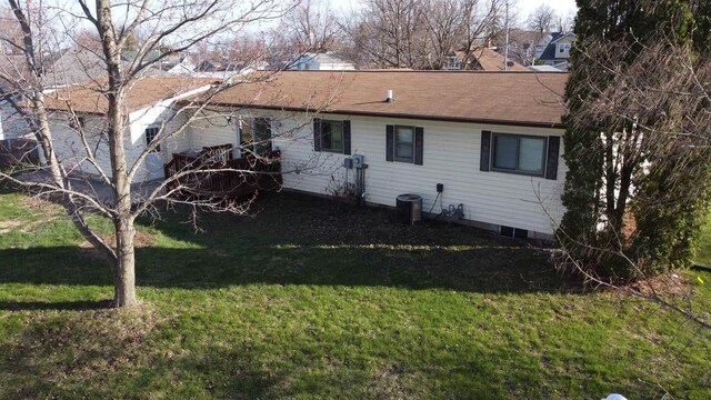 603 Mansion St, Mauston, WI 53948 - rear view of house featuring a lawn and central air condition unit