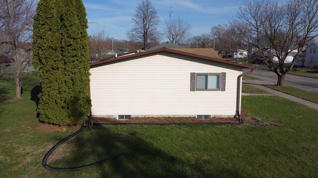 603 Mansion St, Mauston, WI 53948 - view of side of home featuring a lawn