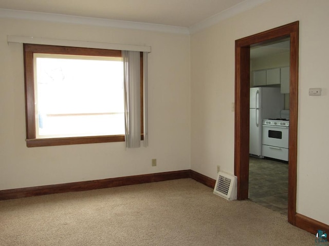 1125 N 22nd St, Superior, WI 54880 - carpeted spare room featuring crown molding, visible vents, and baseboards