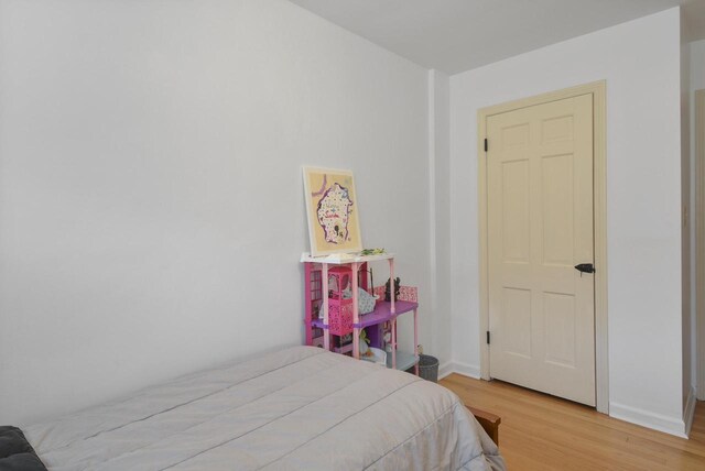7744 2nd Ave, Kenosha, WI 53143 - bedroom featuring baseboards and wood finished floors