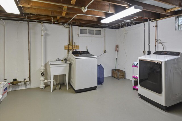 7744 2nd Ave, Kenosha, WI 53143 - washroom featuring independent washer and dryer and laundry area