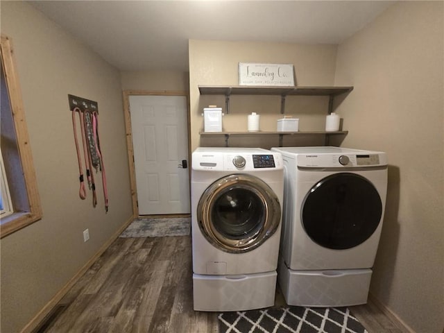 E8577 N County Rd, Elk Mound, WI 54739 - washroom featuring washing machine and dryer, laundry area, baseboards, and wood finished floors