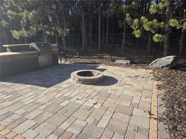 E8577 N County Rd, Elk Mound, WI 54739 - view of patio with a grill, area for grilling, a fire pit, and fence