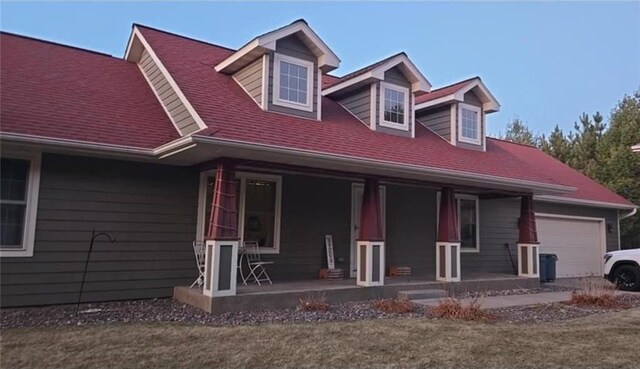 E8577 N County Rd, Elk Mound, WI 54739 - cape cod home with a porch and an attached garage