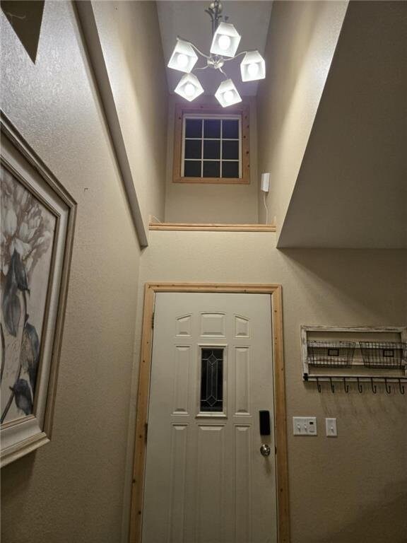 E8577 N County Rd, Elk Mound, WI 54739 - entryway featuring a notable chandelier