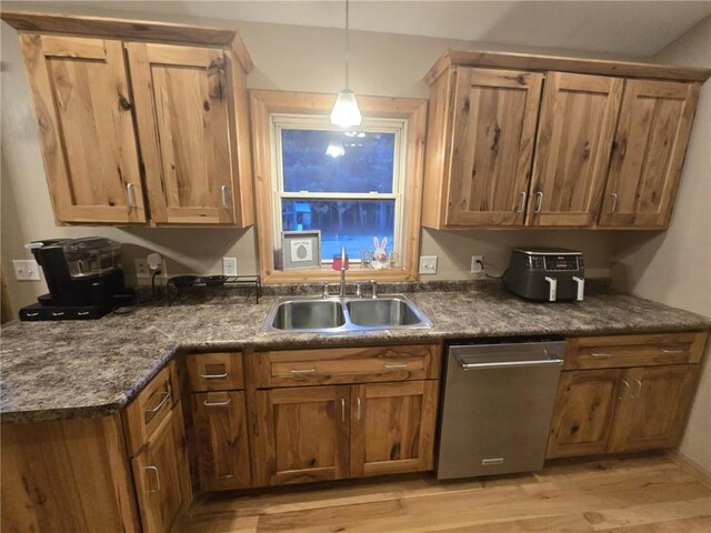 E8577 N County Rd, Elk Mound, WI 54739 - kitchen with a sink, light wood-style flooring, dark countertops, and stainless steel dishwasher