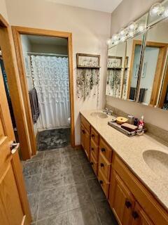 1330 Harvest Cir, Holmen, WI 54636 - bathroom featuring double vanity and toilet