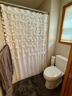 1330 Harvest Cir, Holmen, WI 54636 - bathroom featuring toilet, curtained shower, and tile patterned floors