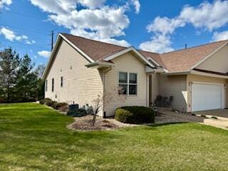 1330 Harvest Cir, Holmen, WI 54636 - view of side of property with a garage, a yard, and concrete driveway