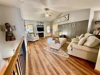 1330 Harvest Cir, Holmen, WI 54636 - living room with ceiling fan, wood finished floors, a fireplace, and lofted ceiling
