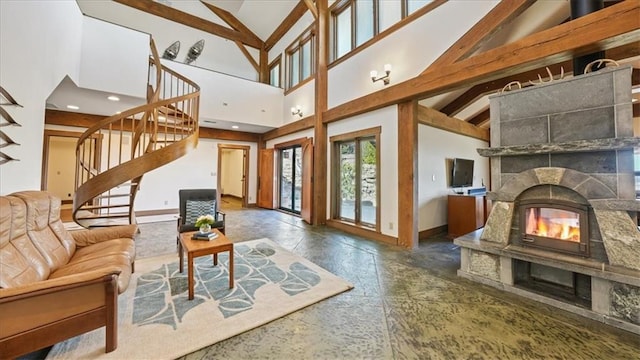 N30732 Square Bluff Rd, Blair, WI 54616 - living area featuring baseboards, high vaulted ceiling, a glass covered fireplace, and stairs