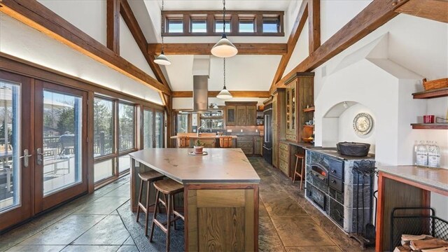 N30732 Square Bluff Rd, Blair, WI 54616 - kitchen featuring beamed ceiling, high quality fridge, open shelves, and a kitchen island
