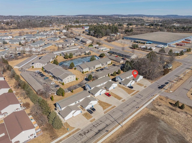 birds eye view of property with a residential view