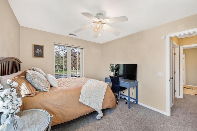 carpeted bedroom with baseboards, ceiling fan, and visible vents