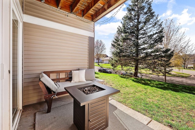 view of patio / terrace with an outdoor fire pit