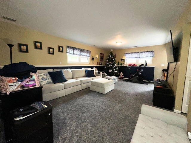 carpeted living room featuring visible vents and plenty of natural light