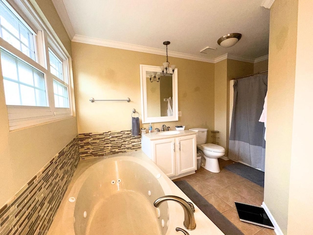 bathroom with a whirlpool tub, vanity, a chandelier, tile patterned flooring, and toilet
