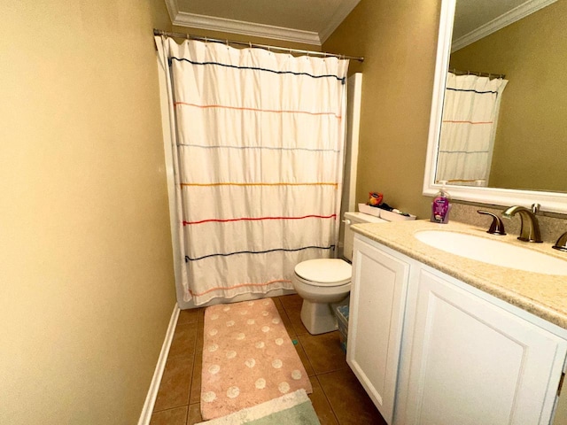 bathroom with toilet, crown molding, vanity, and tile patterned flooring