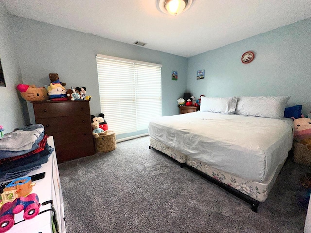 bedroom featuring carpet floors and visible vents