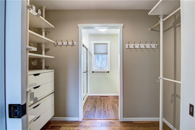 spacious closet with wood finished floors