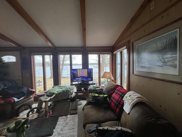 1487 Gunlock Shores Ln, Minocqua, WI 54548 - living area featuring carpet floors, a healthy amount of sunlight, and vaulted ceiling with beams