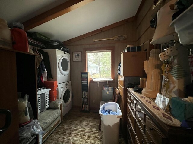 1487 Gunlock Shores Ln, Minocqua, WI 54548 - laundry room with wooden walls, stacked washer / dryer, and laundry area