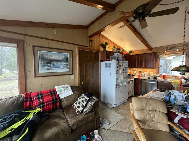 1487 Gunlock Shores Ln, Minocqua, WI 54548 - living area featuring vaulted ceiling with beams, wood walls, and a ceiling fan