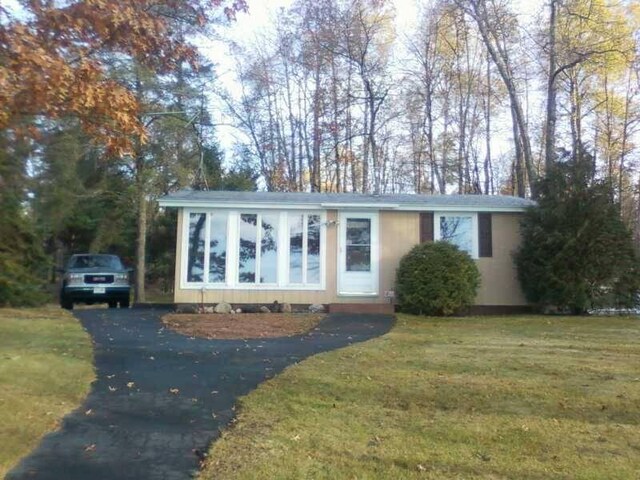1487 Gunlock Shores Ln, Minocqua, WI 54548 - view of front of property featuring driveway and a front yard