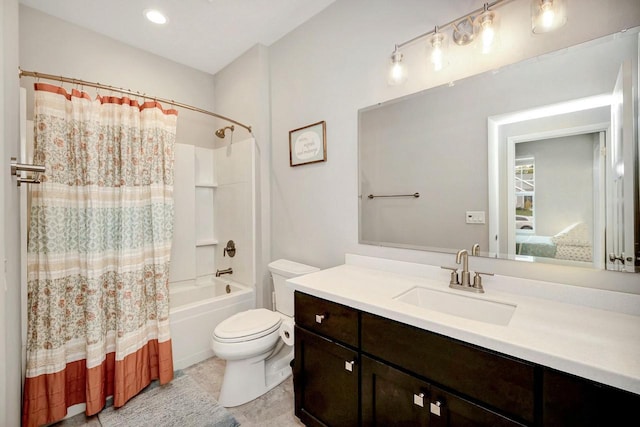 bathroom with shower / tub combo, toilet, vanity, and tile patterned floors