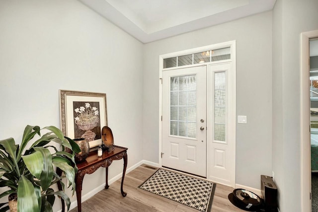 foyer entrance with baseboards and light wood finished floors